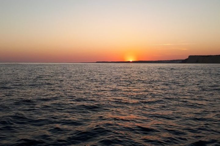 a sunset over a body of water